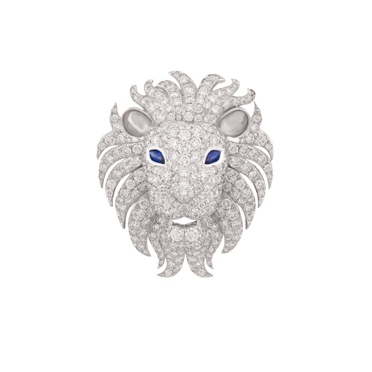 Lion head jewelry piece with diamond details on a white background