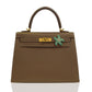 Brown handbag with a decorative clasp on a white background, collection-preview