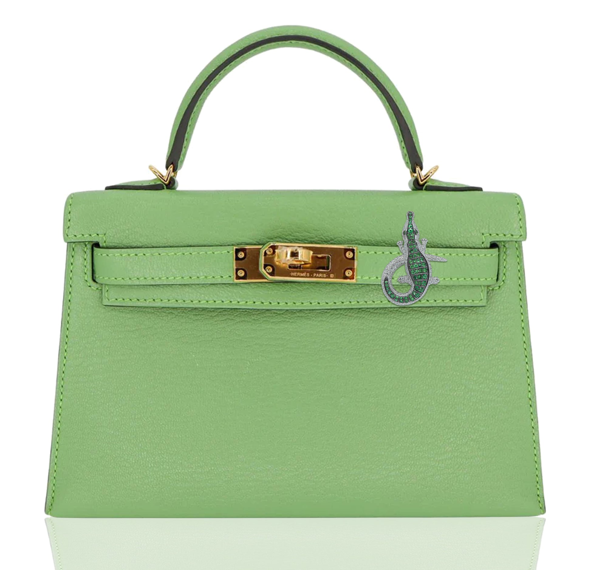 Green handbag with gold hardware on a white background, collection-preview