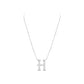 Silver necklace with a 'H' pendant on a white background