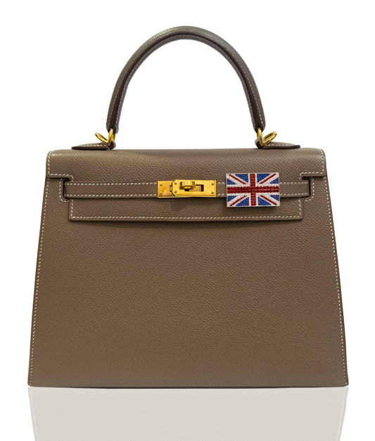Brown handbag with a gold clasp and Union Jack flag on a white background, collection-preview