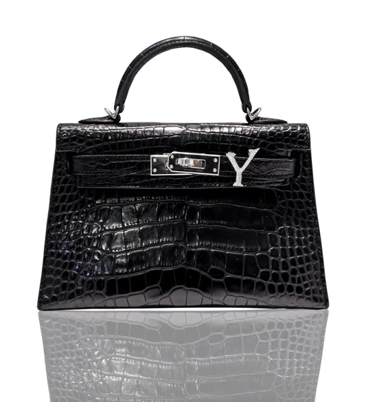 A black handbag with a crocodile pattern and a natural diamond-encrusted 'Y' letter set in a metallic clasp, collection-preview.