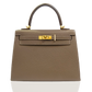 Beige handbag with gold hardware on a white background, collection-preview