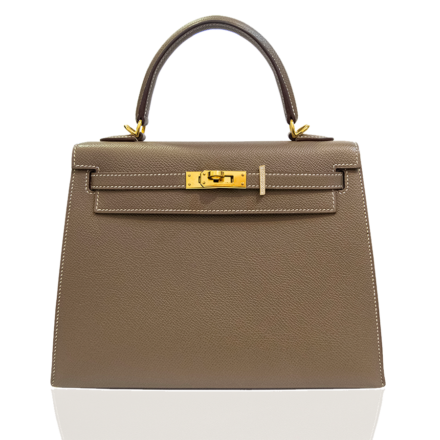 Beige handbag with gold hardware on a white background, collection-preview