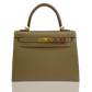Beige handbag with gold hardware and a visible brand logo on a white background, collection-preview