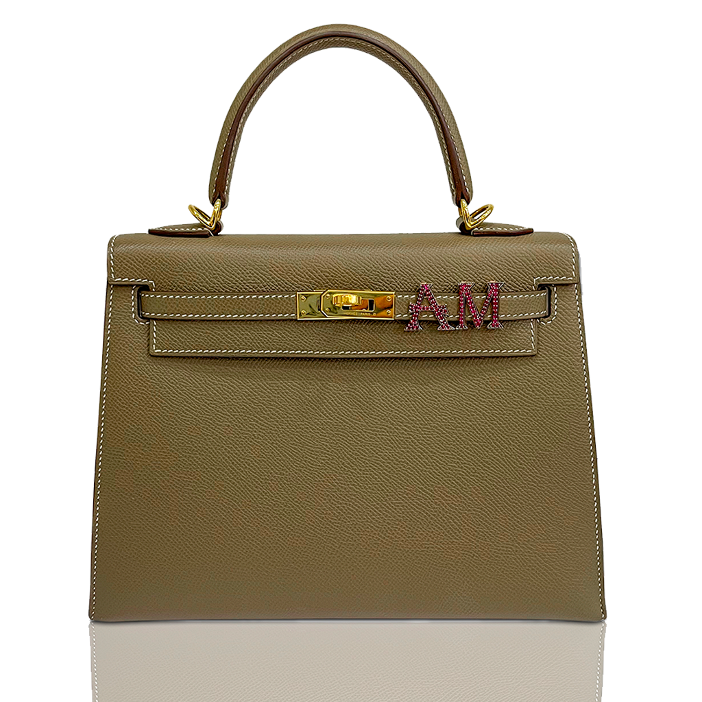 Beige handbag with gold hardware and a visible brand logo on a white background, collection-preview