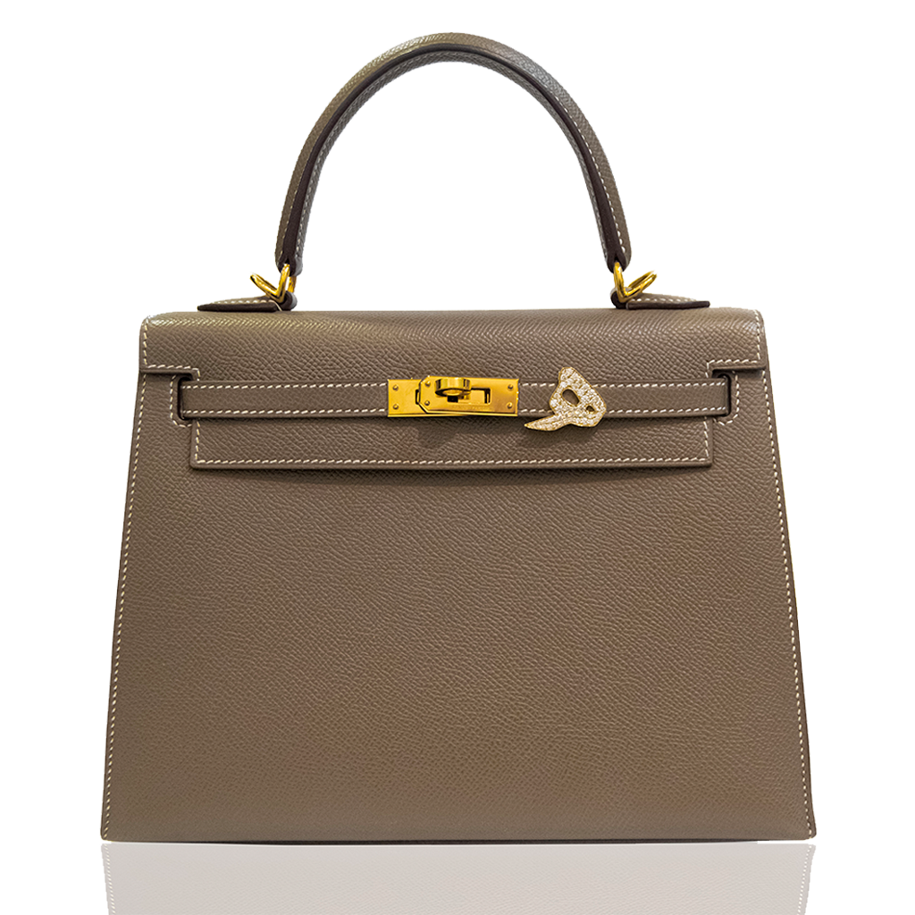 Brown handbag with gold hardware on a white background, collection-preview